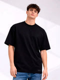 Person wearing a black t-shirt and blue jeans on a white background