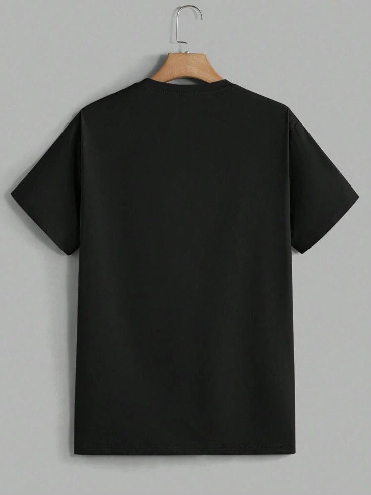 Black t-shirt on a hanger against a gray background