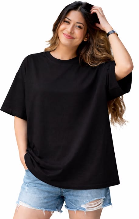 Woman wearing a black oversized t-shirt and denim shorts on a white background